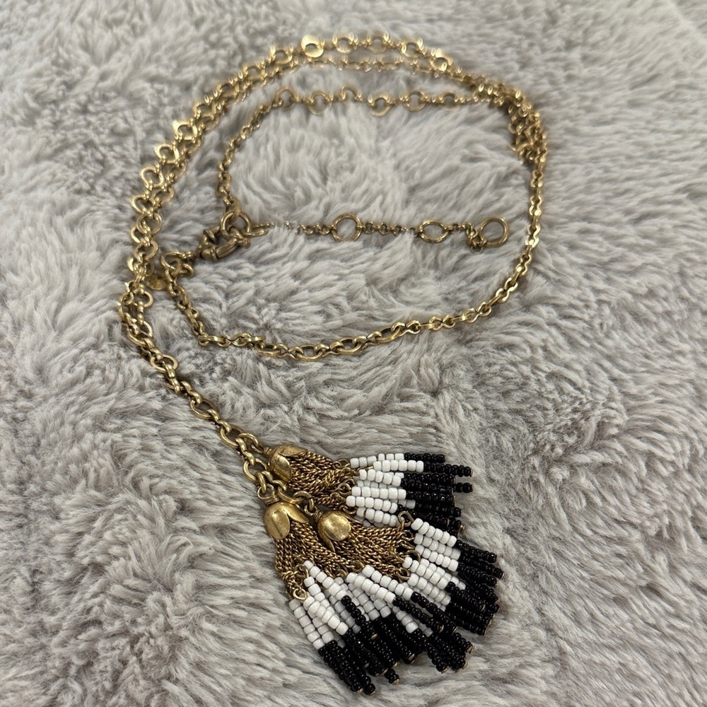 J.Crew long gold necklace With black and white Color beaded tassels